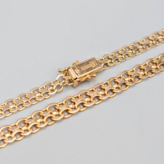 Doserad X-Länk i Guld-1